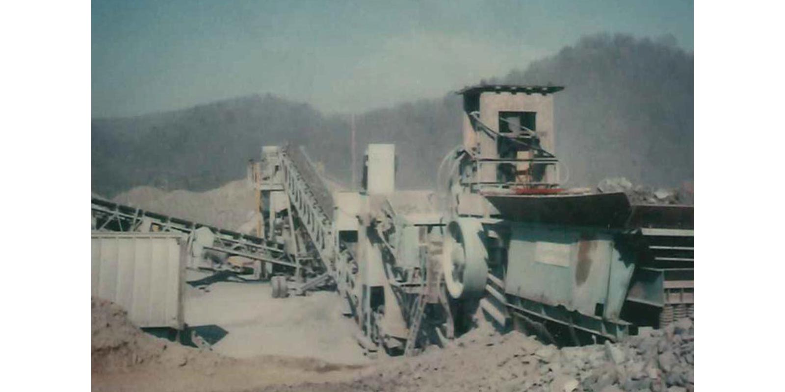 historical photograph of crushing equipment on a work site