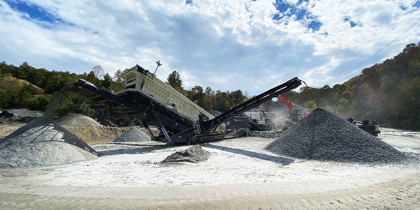 rock crushing equipment at work on a quarry site